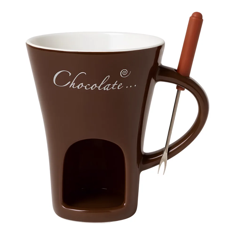 Chocolate brown fondue mug with white interior, the arch for the tea light in the base and the fondue fork resting in the handle.